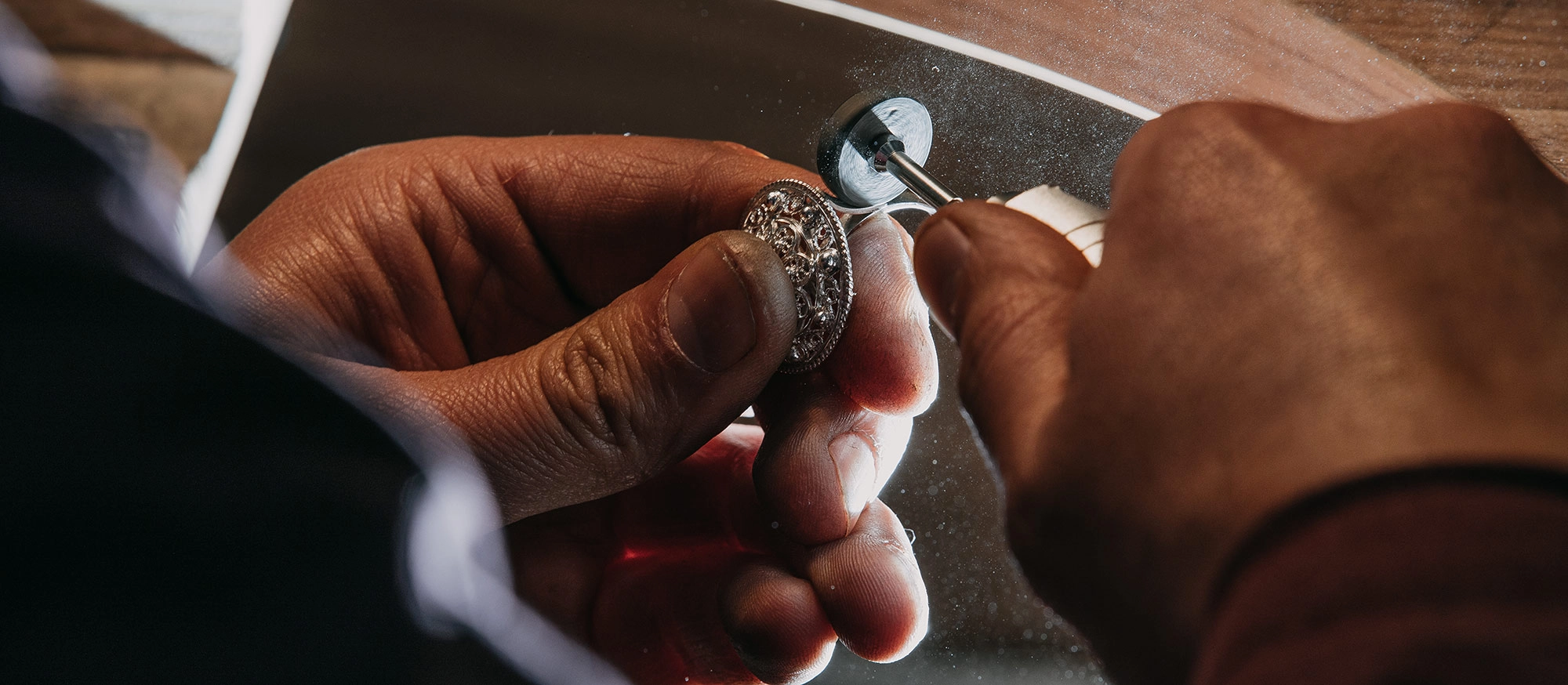 Man crafting jewelry by hand