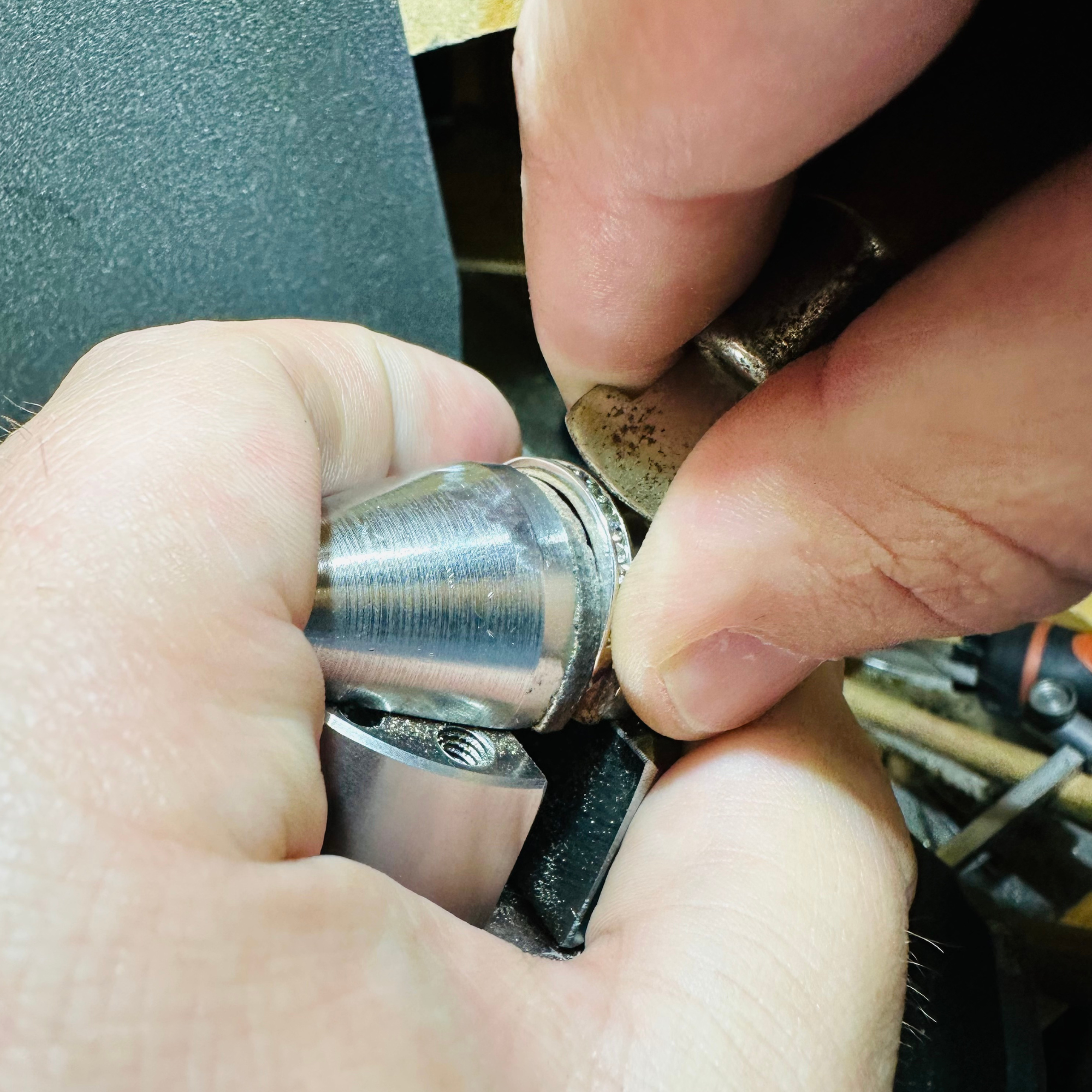 Jewelry Repair - Hands polishing jewelry